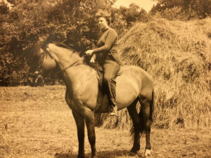 Old photo of woman riding horse