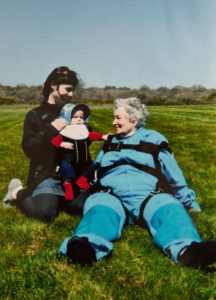 Woman with family after skydiving