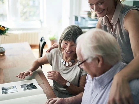 Family looking through scrapbook